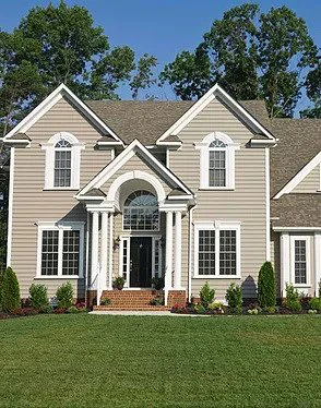 a house with a freshly cut lawn